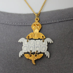 HP! Turtle Articulated Gold Tone White Necklace